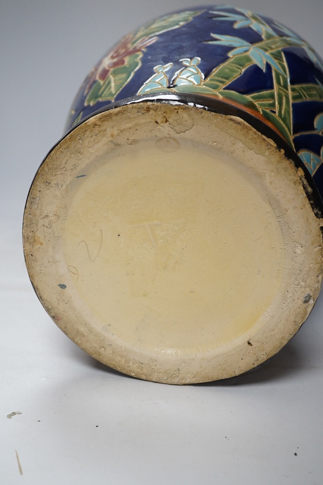 A South East Asian polychrome pottery vase and a Staffordshire pottery greyhound pen holder, vase 53cm high. Condition - vase fair, pen holder marks to glazing